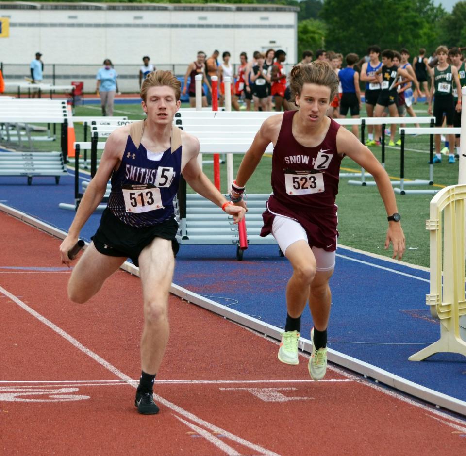 Smithsburg's Cameron Rejonis, left, edges Snow Hill's Justin Hurney at the finish line as the Leopards place second in the Class 1A boys 4x800 relay in 8:23.68.