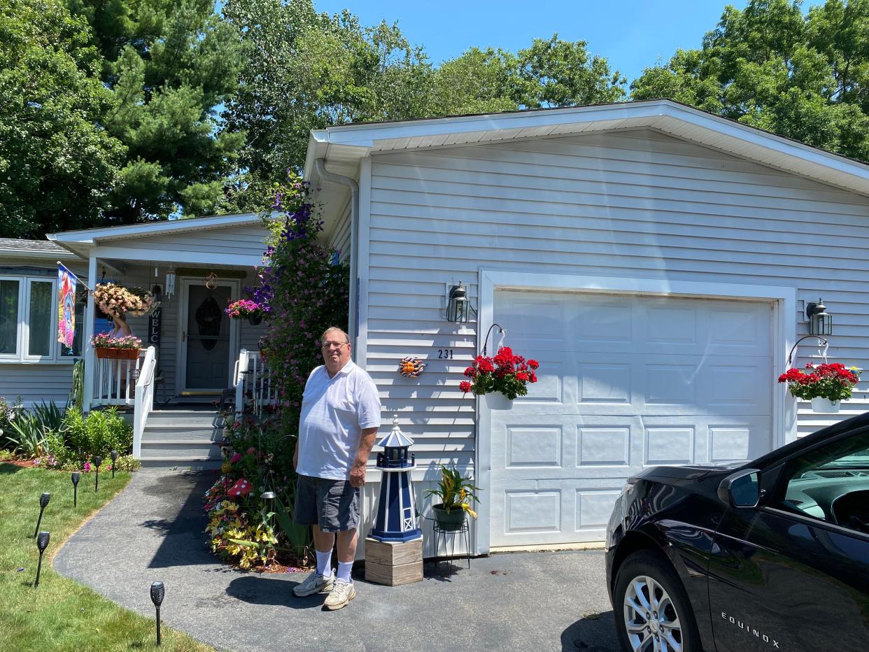 Leisurewoods resident Stuart Briggs stands in front of his manufactured home off Highland Street in Taunton on Tuesday, July 16, 2024.