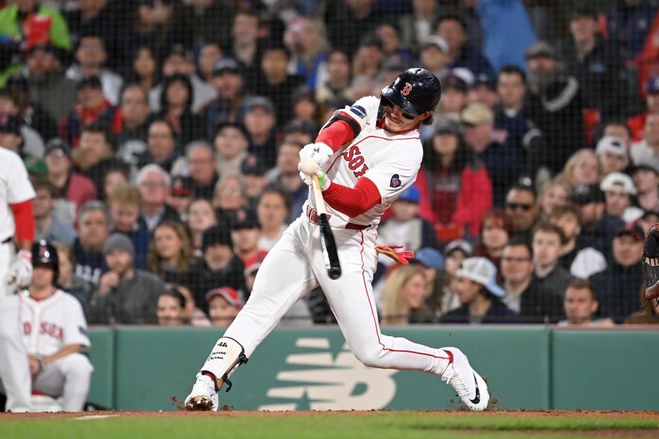 Boston Red Sox left fielder Jarren Duran (16) hits a double against the Cleveland Guardians during the third inning Wednesday in Boston.