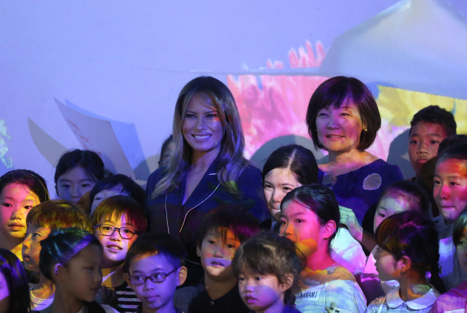 U.S. first lady Melania Trump, center, poses with Japanese Prime Minister Shinzo Abe's wife Akie Abe, right, and children for a photo during a visit to a digital art museum in Tokyo Sunday, May 26, 2019. (AP Photo/Koji Sasahara)