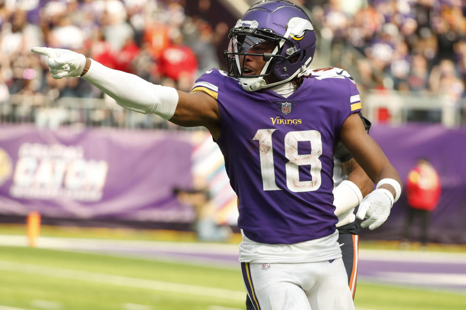 Minnesota Vikings wide receiver Justin Jefferson (18) reacts after catching a pass during the second half of an NFL football game against the Chicago Bears, Sunday, Oct. 9, 2022, in Minneapolis. (AP Photo/Bruce Kluckhohn)