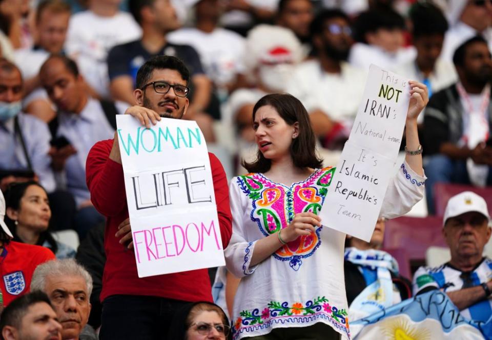 iran fans in the stands hold up signs of protest ahead of the fifa world cup group b match at the khalifa international stadium, doha picture date monday november 21, 2022 photo by mike egertonpa images via getty images