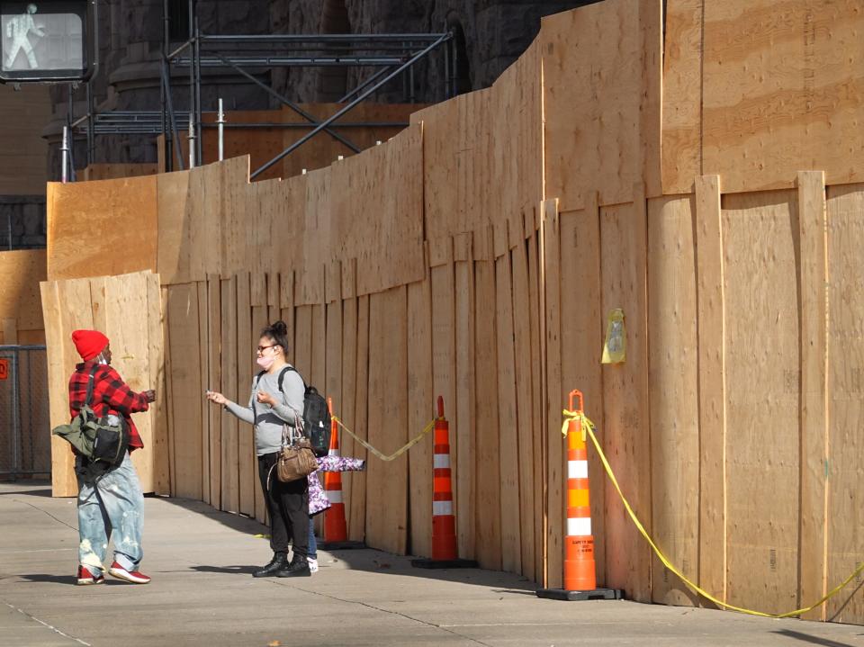 Plywood covers a building front near the Hennepin County Government Center in preparation for the trial of former Minneapolis police officer Derek Chauvin on 28 March, 2021Getty Images