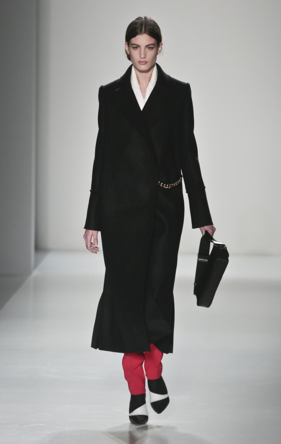 Fashion from the Victoria Beckham Fall 2014 collection is modeled, during New York Fashion Week on Sunday Feb. 9, 2014. (AP Photo/Bebeto Matthews)