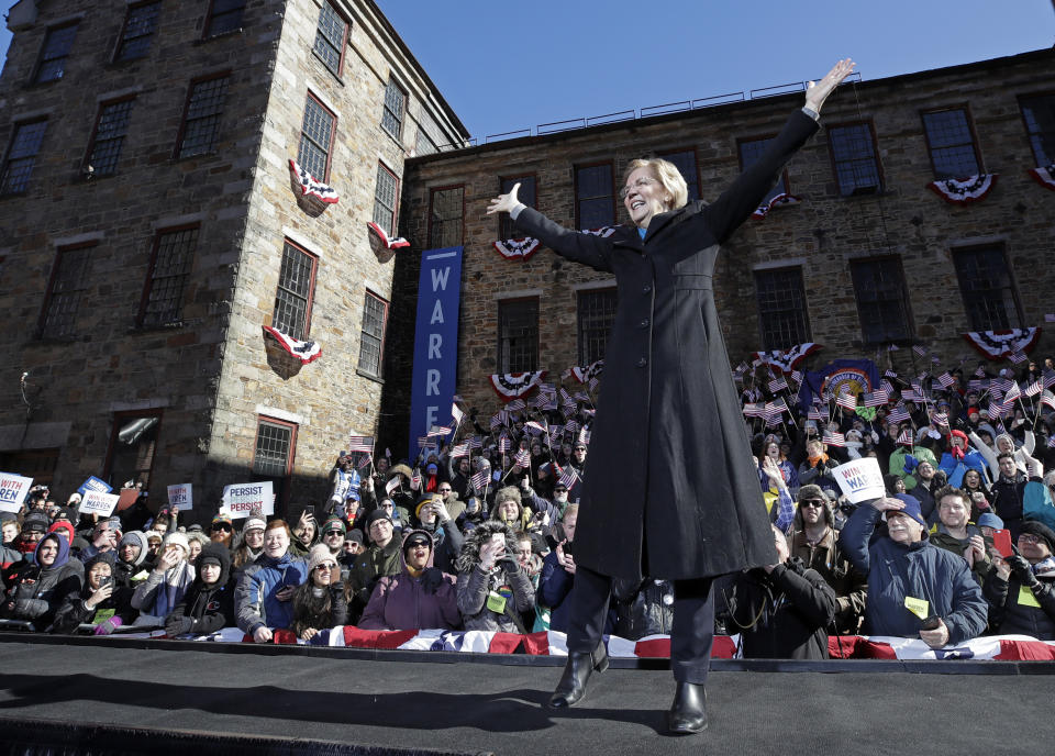 U.S. Sen. Elizabeth Warren, D-Mass., acknowledges cheers as she takes the stage during an event to formally launch her presidential campaign, Saturday, Feb. 9, 2019, in Lawrence, Mass. (AP Photo/Elise Amendola)