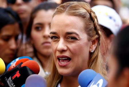 Lilian Tintori, wife of Venezuela's opposition leader Leopoldo Lopez, talks to the media after casting her vote during an unofficial plebiscite against President Nicolas Maduro's government and his plan to rewrite the constitution, in Caracas, Venezuela July 16, 2017. REUTERS/Christian Veron