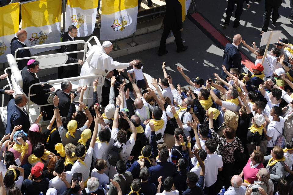 Pope Francis greets faithful upon his arrival at Loreto's cathedral, central Italy, Monday, March 25, 2019. Francis has traveled to a major Italian pilgrimage site dedicated to the Virgin Mary to sign a new document dedicated to today's youth. (AP Photo/Sandro Perozzi)