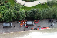 <p>Officials and rescuers gather near vehicles after a car slammed into soldiers on patrol in Levallois-Perret, outside Paris on August 9, 2017 injuring six, two of them seriously, police in the French capital said. (Photo: Thierry Chappe/AFP/Getty Images) </p>