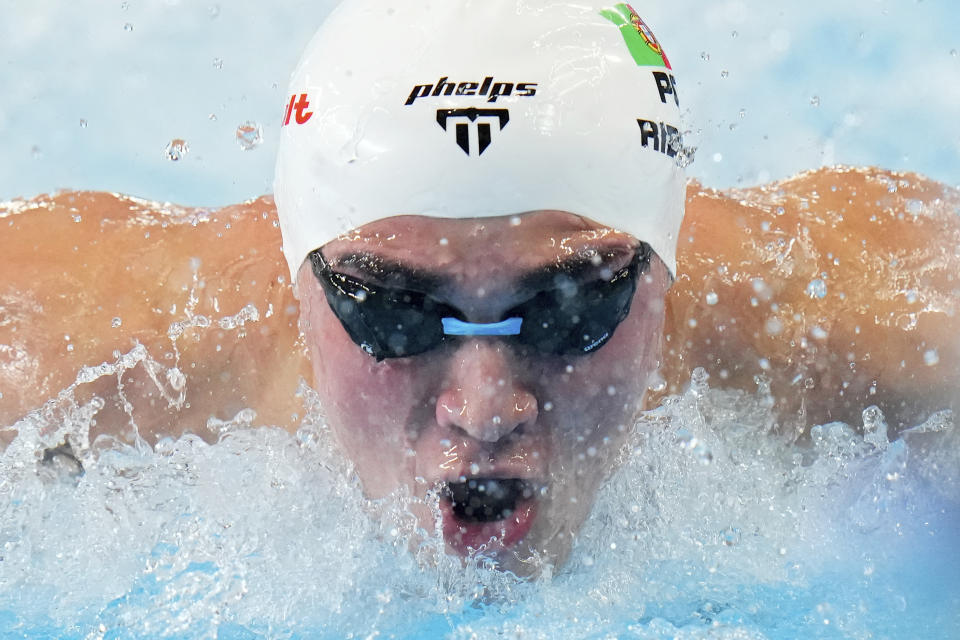 Diogo Matos Ribeiro of Portugal swims to win the men's 100 meters butterfly final at the World Aquatics Championships in Doha, Qatar, Saturday, Feb. 17, 2024. (AP Photo/Hassan Ammar)
