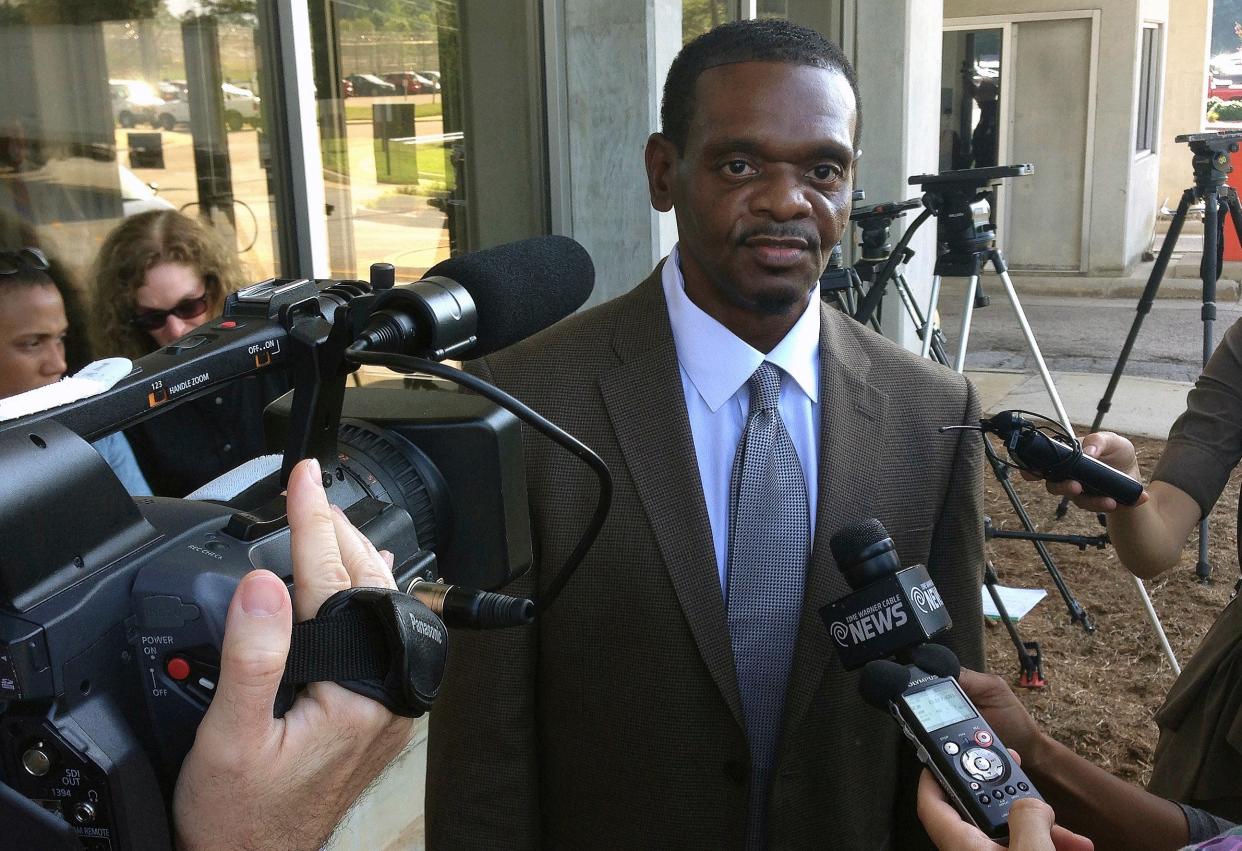 <p>Henry McCollum walks out of prison after being released from Central Prison in Raleigh on 3 September, 2014.</p> (AP)