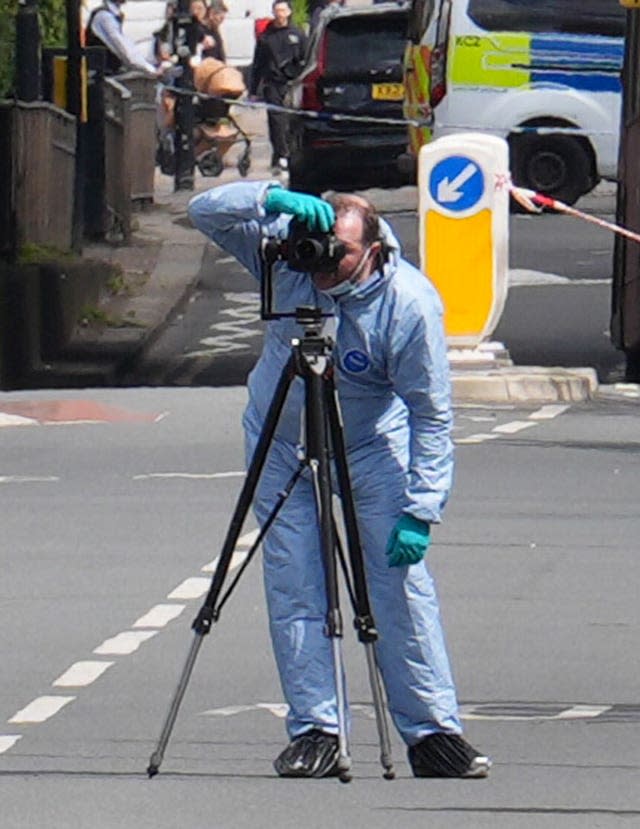 A forensic investigator in Hainault, north east London. 
