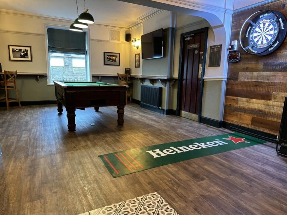 Lancashire Telegraph: A games area with a new pool table, dart board, and TV is one of the new features