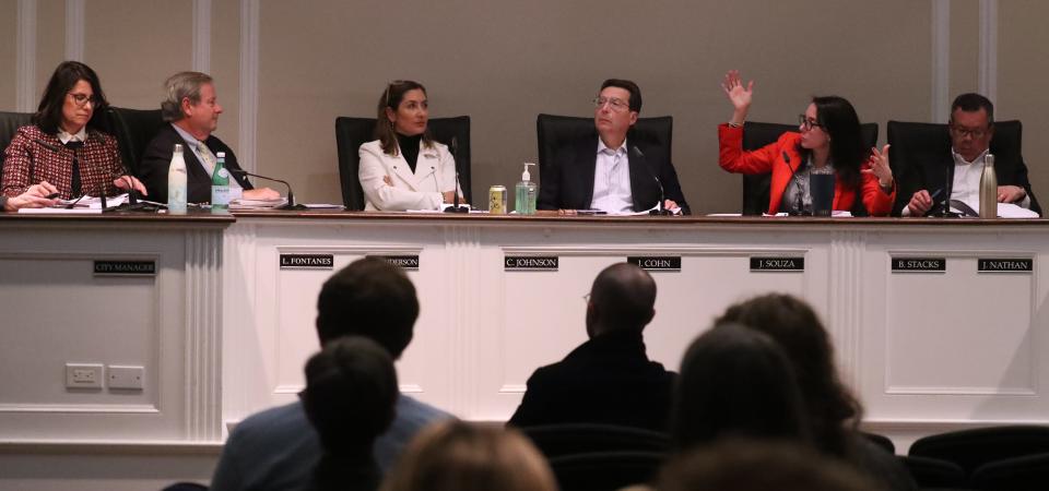 Rye councilmembers and Mayor Josh Cohn, center, argue a point during a city council meeting at city hall March 13, 2023.