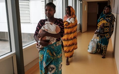 Three mothers and their newborns walk out of the Central Hospital of Mayotte, on November 19, 2018  - Credit: Eduardo Soteras Jalil/The Telegraph