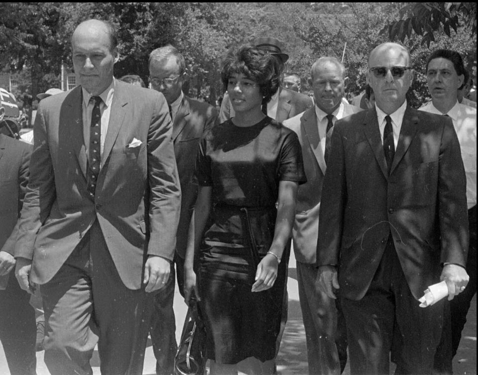 Vivian Malone Jones is led into Foster Auditorium at the University of Alabama in Tuscaloosa, Ala. in September 1963. Gov. George C. Wallace tried to block her entrance into the University.  (AP Photo/Montgomery Advertiser)