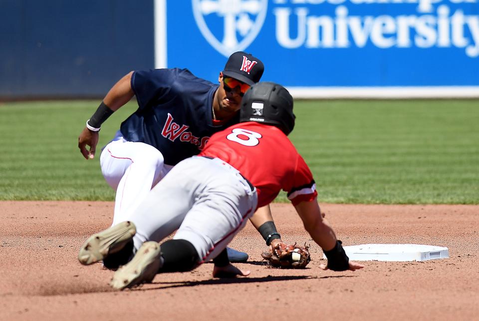 Worcester's Jeter Downs places the tag on Cole Freeman, who was thrown out trying to steal on WooSox catcher Connor Wong during Wednesday's game at Polar Park.