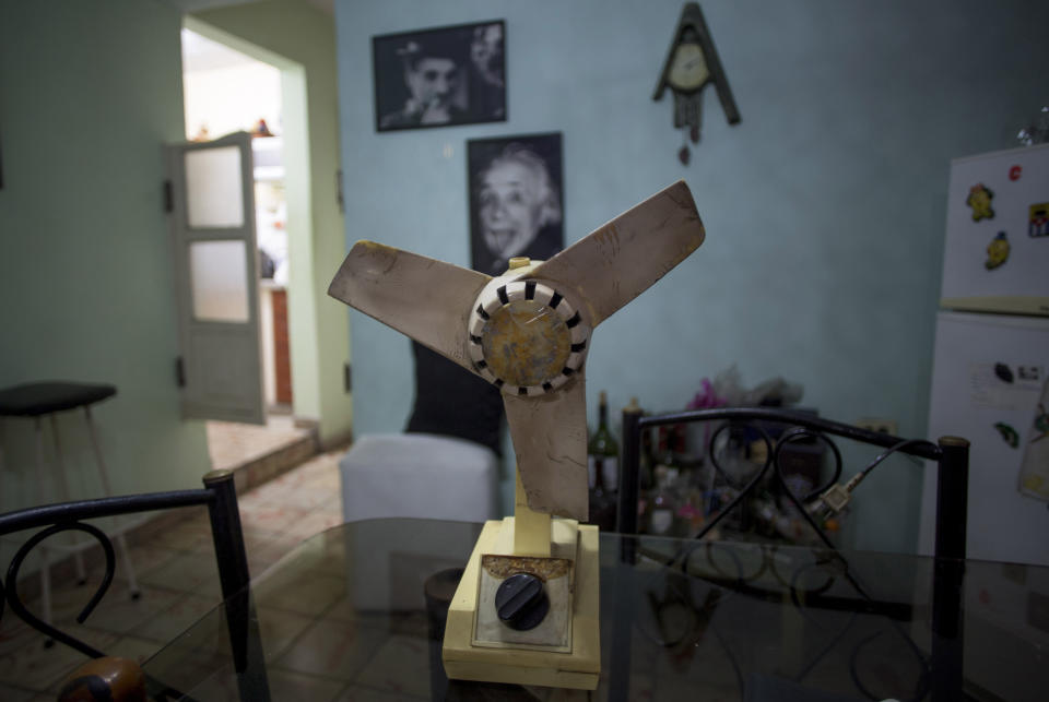 An operational 1980s Orbita fan from Russia sits idle on the dining room table of a home in Havana, Cuba, Monday, Oct. 14, 2019. This fan once worked inside a defrosting refrigerator. (AP Photo/Ismael Francisco)