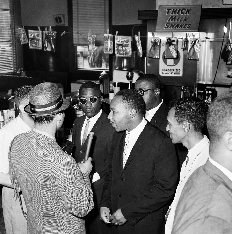 Freedom Riders at the bus station in Montgomery, Ala., on May 24, 1961, wait to purchase tickets to continue their ride through the South. At center is civil rights leader Martin Luther King Jr.