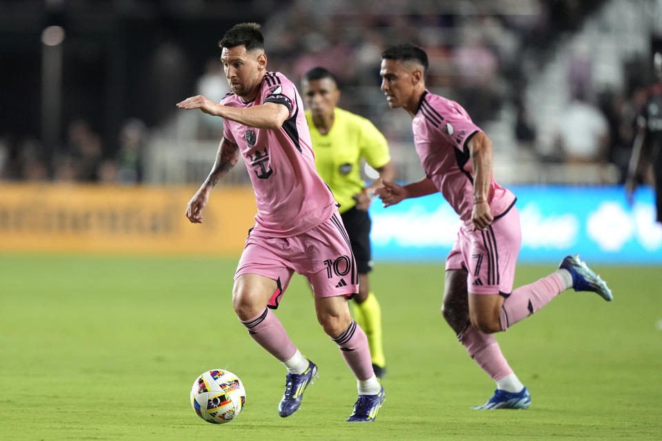 Inter Miami forward Lionel Messi (10) runs with the ball during the first half of an MLS soccer match against D.C. United Saturday, May 18, 2024, in Fort Lauderdale, Fla. (AP Photo/Lynne Sladky)