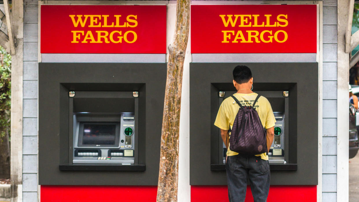 Key West, USA - January 9, 2015: Man using Wells Fargo ATM on Duval street, Key West.