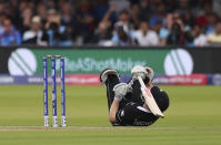 New Zealand's Henry Nicholls dives on the ground in an attempt to make it to the crease. (AP Photo/Aijaz Rahi)