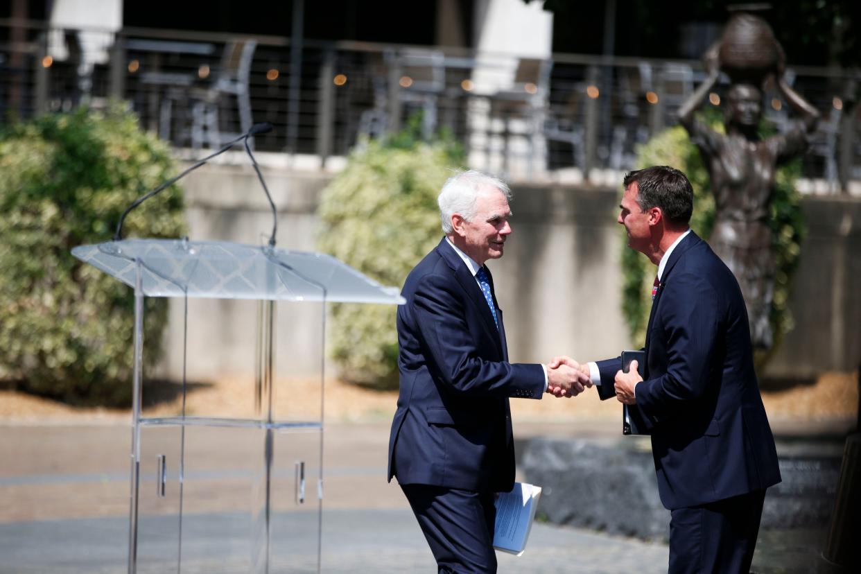 Governor Kevin Stitt and his appointment for Attorney General for the State of Oklahoma, Tulsan, John O'Connor shake hands on July 23, 2021 in Tulsa, Okla.