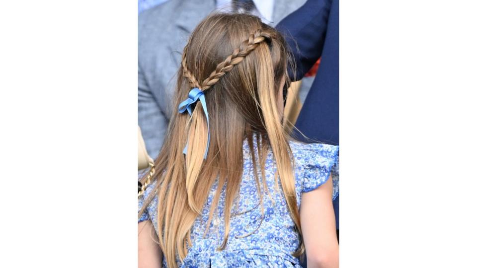 Princess Charlotte with a blue bow in her hair at Wimbledon