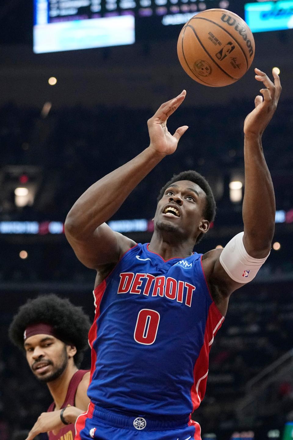 Pistons center Jalen Duren reaches for a rebound in front of Cavaliers center Jarrett Allen, left, in the first half on Wednesday, Jan. 31, 2024, in Cleveland.