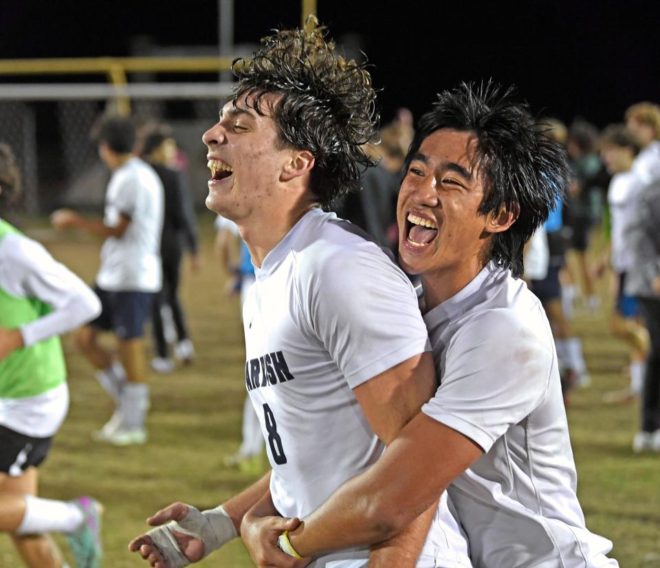 Celebrating Parish's Colton Segneri (#8) who made the only and winning goal of the night with his teammate Ezekiel Tabag  (#5). The Parish Bulls won the Class 5A-District 10 final Thursday night 1-0 over the hosting Braden River Pirates.