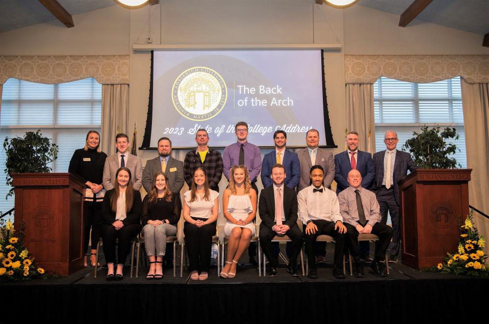 Pictured in the front row, from left to right, are Megan Muzy, Lindsay Dodds, Shelbea Frank, Morgan Blonde, Andrew Kolf, Jalen Adams and Keith Christy. In the back row, from left, are Jennifer Carlson, Adam Krug, Travis Exrleben, Erik Skampo, Max Benedict, Jeremy VanEpps, Darin Seiler, Charles Reid and Adrian College President Jeffrey Docking. Each of the individuals had a hand of some sort in bringing together the 2023 State of the College address at Adrian College, which is conducted by Docking and features various updates, presentations and speakers.