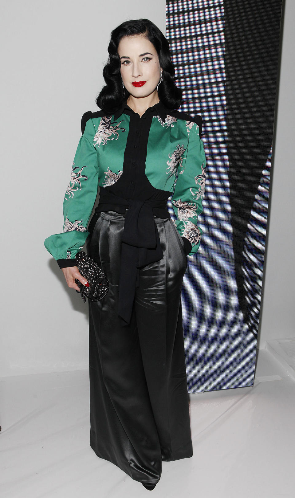 Dita Von Teese attends the Carolina Herrera Spring 2014 collection on Monday, Sept. 9, 2013, during Mercedes-Benz Fashion Week in New York. (Photo by Amy Sussman/Invision/AP)