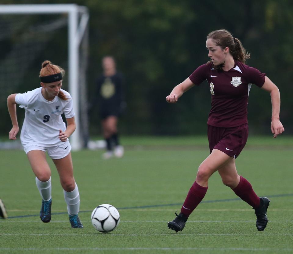 Arlington's Casey Stowell turns away from John Jay's Kaleigh Horos during a Sept. 28, 2021 game.