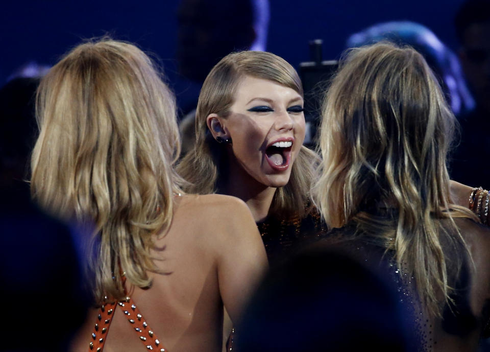 Taylor Swift reacts as she heads to the stage to accept the award for best female video for "Blank Space" at the 2015 MTV Video Music Awards in Los Angeles, California August 30, 2015.  REUTERS/Mario Anzuoni