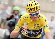 Cycling - The 104th Tour de France cycling race - The 103-km Stage 21 from Montgeron to Paris Champs-Elysees, France - July 23, 2017 - Team Sky rider and yellow jersey Chris Froome of Britain holds a glass of champagne after the start. REUTERS/Benoit Tessier