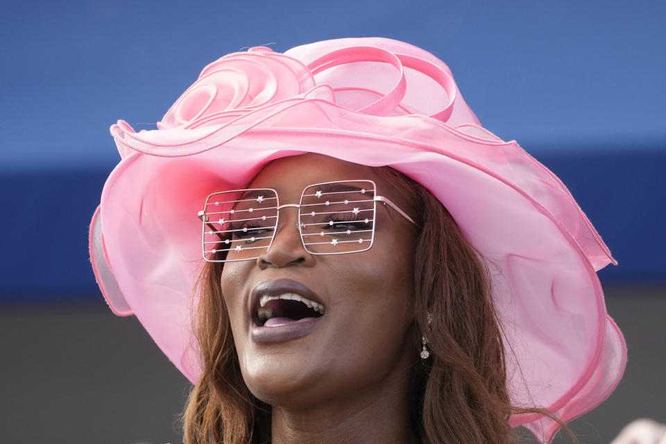 Veneda Alhassan cheers on horses during the Pegasus World Cup horse races, Saturday, Jan. 27, 2024, at Gulfstream Park in Hallandale Beach, Fla. (AP Photo/Wilfredo Lee)