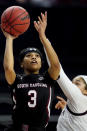 South Carolina guard Destanni Henderson (3) shoots over Texas A&M guard Jordan Nixon (5) of an NCAA college basketball game Sunday, Feb. 28, 2021, in College Station, Texas. (AP Photo/Sam Craft)