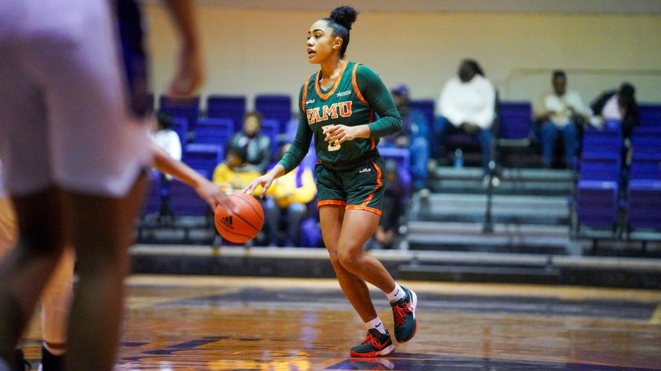 Florida A&M University women's basketball guard Ahriahna Grizzle (with ball) handles ball against Alcorn State at  Davey L Whitney Complex, Lorman, Mississippi, Saturday, Jan. 21, 2023
