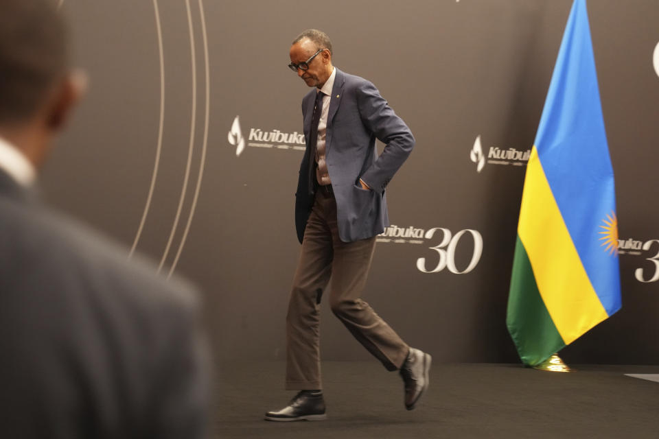 Rwanda's President Paul Kagame leaves after a press conference at Kigali Convention Centre in Kigali, Rwanda, Monday, April 8, 2024. Rwandans are commemorating 30 years since the genocide in which an estimated 800,000 people were killed by government-backed extremists, shattering this small east African country that continues to grapple with the horrific legacy of the massacres. (AP Photo/Brian Inganga)