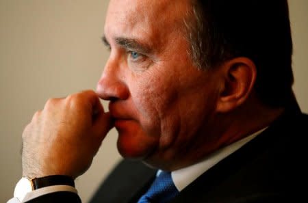 FILE PHOTO: Sweden's Prime Minister Stefan Lofven (R) gestures during an interview at the World Trade Organization (WTO) headquarters in Geneva, Switzerland November 22, 2017. REUTERS/Denis Balibouse