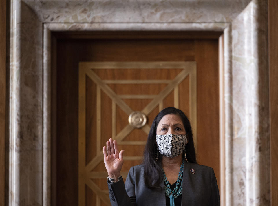 FILE - In this Feb. 23, 2021, file photo, Rep. Deb Haaland, D-N.M., is sworn in before the Senate Committee on Energy and Natural Resources hearing on her nomination to be Interior Secretary on Capitol Hill in Washington. (Jim Watson/Pool via AP, File}