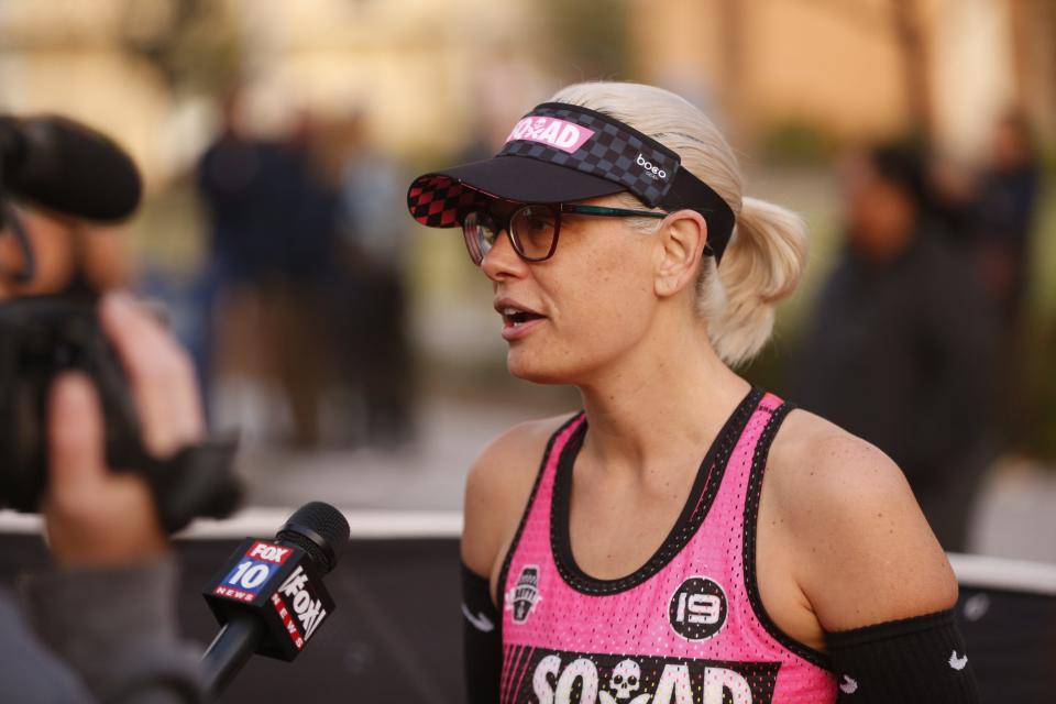 Sen. Kyrsten Sinema talks with TV stations before the Rock 'N' Roll half-marathon in Phoenix, Jan. 20, 2019.