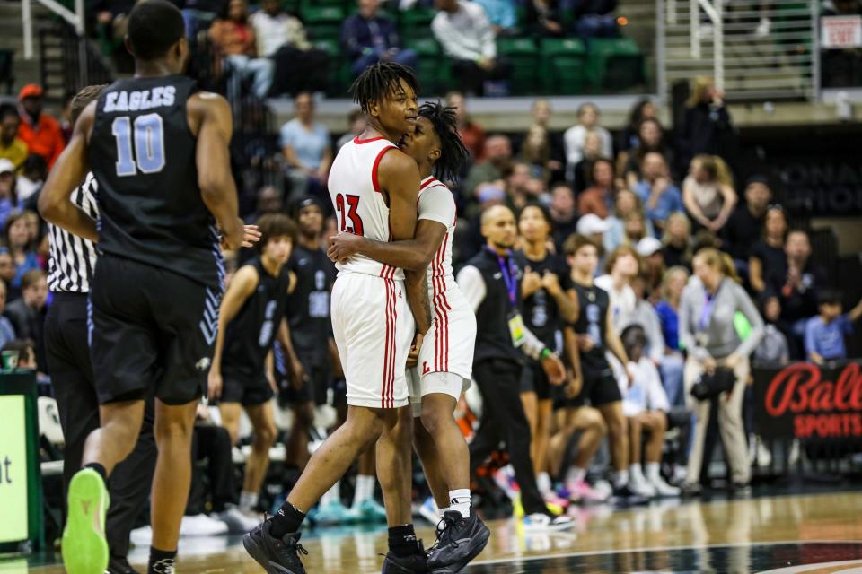 Warren Lincoln’s Moses Blackwell embraces Jamari Culliver late in the fourth after going up 10 points against Grand Rapids Christian during the MHSAA boys basketball Division 2 final at Breslin Center in East Lansing on Saturday, March 16, 2024.