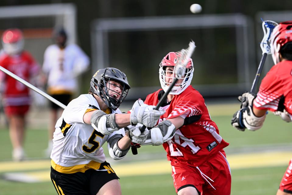 NORTH EASTHAM  5/16/23    Joey Berardi of Nauset puts a shot past Reece Bright of Barnstable