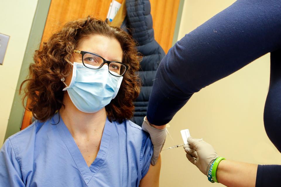 Dr. Megan Ranney is vaccinated against COVID-19 in December 2020 at The Miriam Hospital in Providence. “This is the true light at the end of the tunnel," she said at the time. Ranney was on the front lines of the pandemic fight.