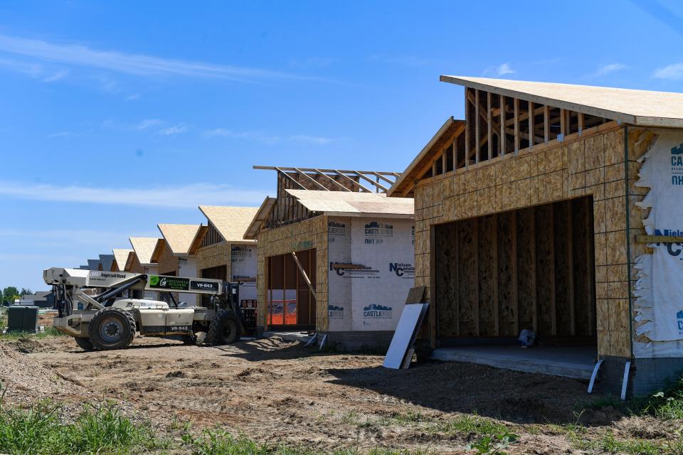 A row of new homes are under construction on Thursday, July 14, 2022, in western Sioux Falls.