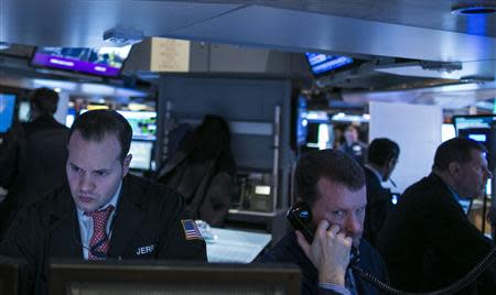 Traders work on the floor of the New York Stock Exchange January 10, 2014. REUTERS/Brendan McDermid
