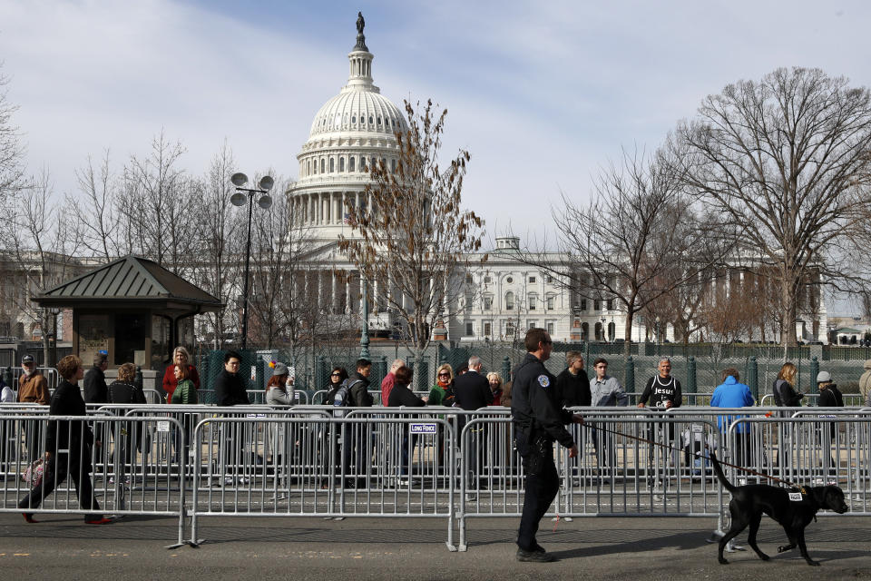 <p>A Capitol Police K-9 unit works security as a line forms for the public viewing of the late Rev. Billy Graham at the Capitol, Wednesday, Feb. 28, 2018, in Washington. (Photo: Jacquelyn Martin/AP) </p>