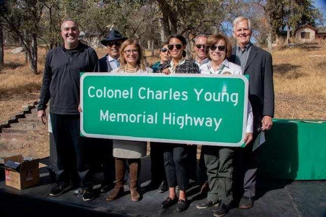 Renotta Young, third from left, joins Charles Young Foundation board members and others in celebrating the naming of a portion of California State Route 198 as Colonel Charles Young Memorial Highway.