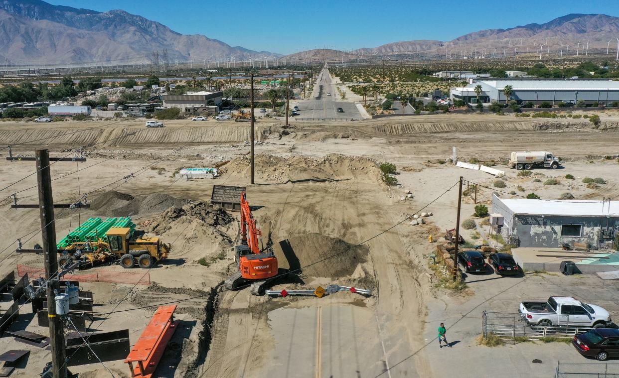 Crews repair Dillon Road, one of Desert Hot Springs' main arteries, on Oct. 10. The roadway was damaged in Tropical Storm Hilary in August.