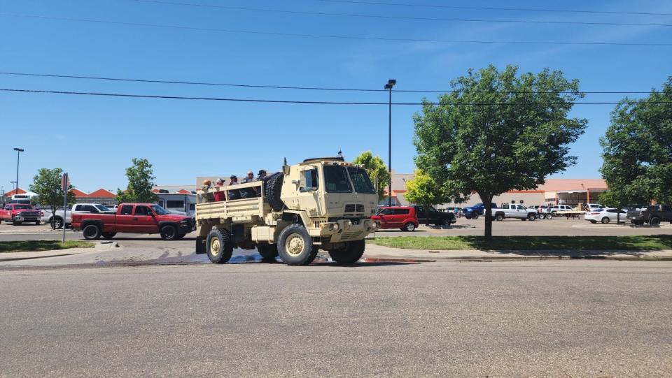 Members of the National Guard were taking residents to some of 
the flooded areas to recover some items from their houses Friday after they were evacuated due to the storm.